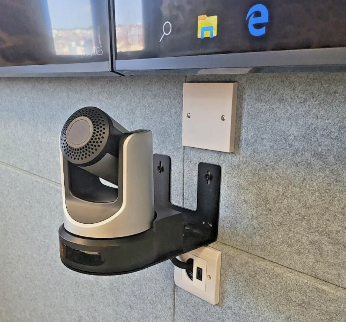 PTZ camera wall mount showing rear cable management design